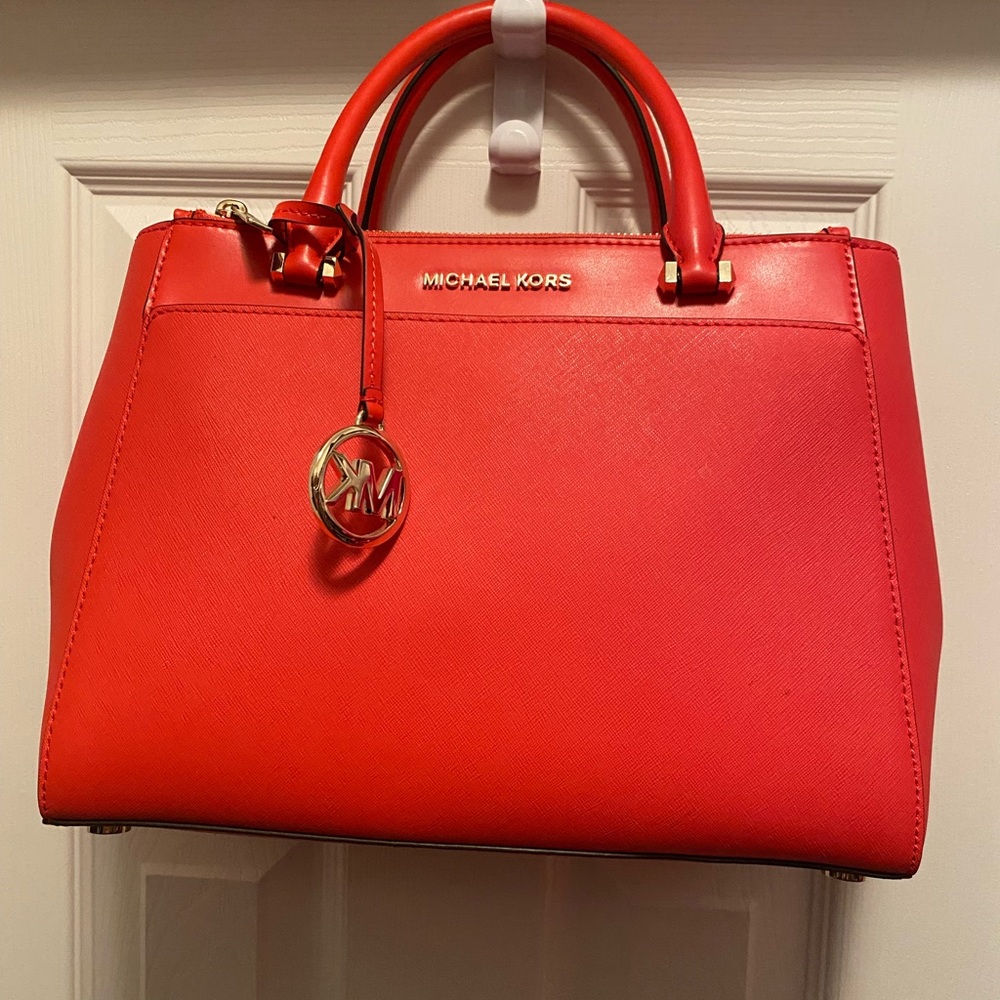 Michael Kors leather coral satchel with crossbody strap and gold hardware